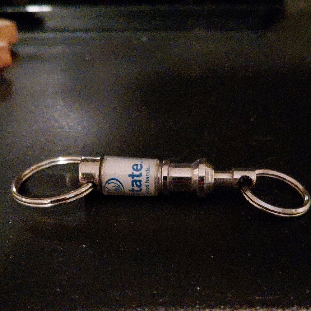Vintage Silver Alkstate Keychain with Blue And White Accents